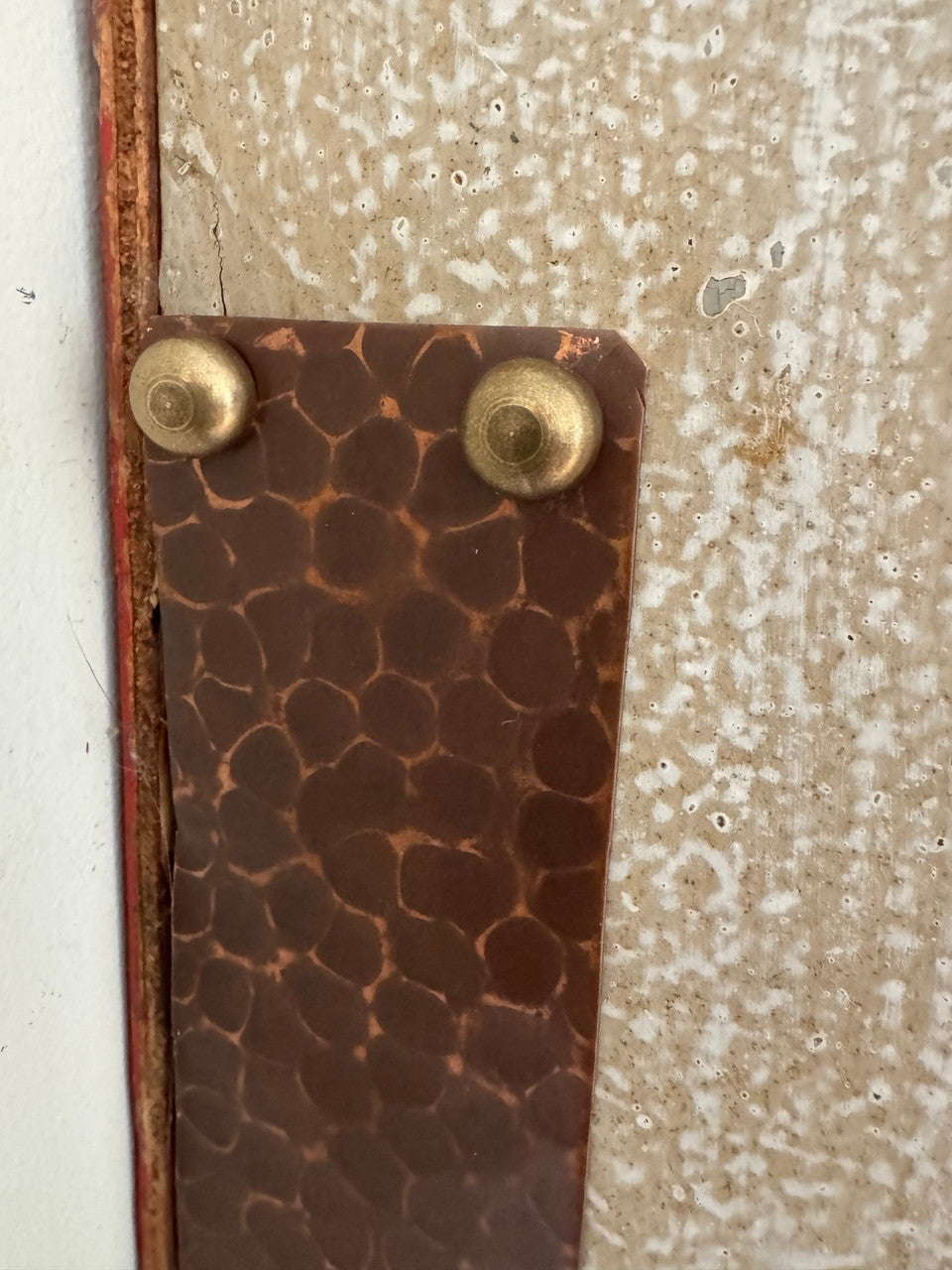 A great way to highlight design features.  Brass screw concealer is fastening a copper plate.