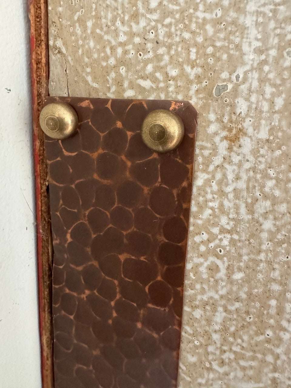 A great way to highlight design features.  Brass screw concealer is fastening a copper plate.