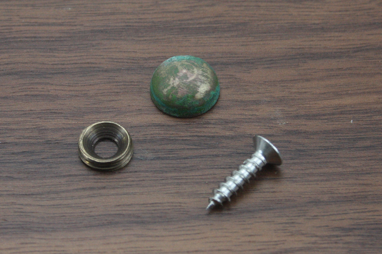 These copper screw covers are used for hiding unsightly screws or fasteners, or as a highlight feature. These screw covers are machined from solid brass and have an oxidized copper finish. The screw cover accepts a 4mm diameter screw with an 8mm diameter head and comes in either a pack of 10 or 100. Copper patina is shown in photo